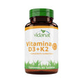 Frasco ámbar de 60 tabletas de Vitamina D3 + K2 Vidanat con tapa verde y etiqueta naranja, sobre fondo blanco