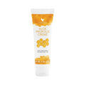 Tubo blanco de 113 g de Aloe Propolis Creme Forever con banda color miel y diseño de panal, sobre fondo blanco